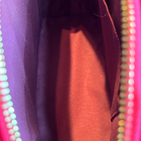 Is this pink purse with gold zipper closure and hardware accents 10x7x5” … - Picture 6 of 8